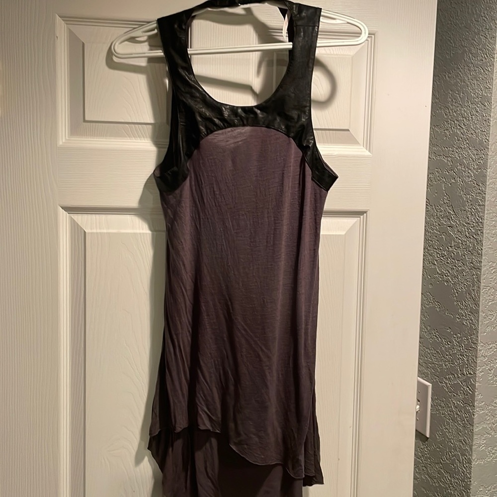Free people top w leather detailing at top.  Swoop sexy back